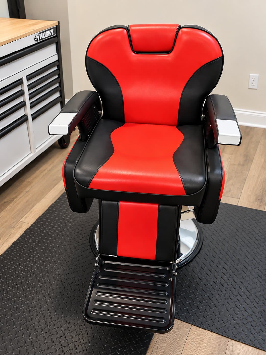 The red and black barber chair, straight on