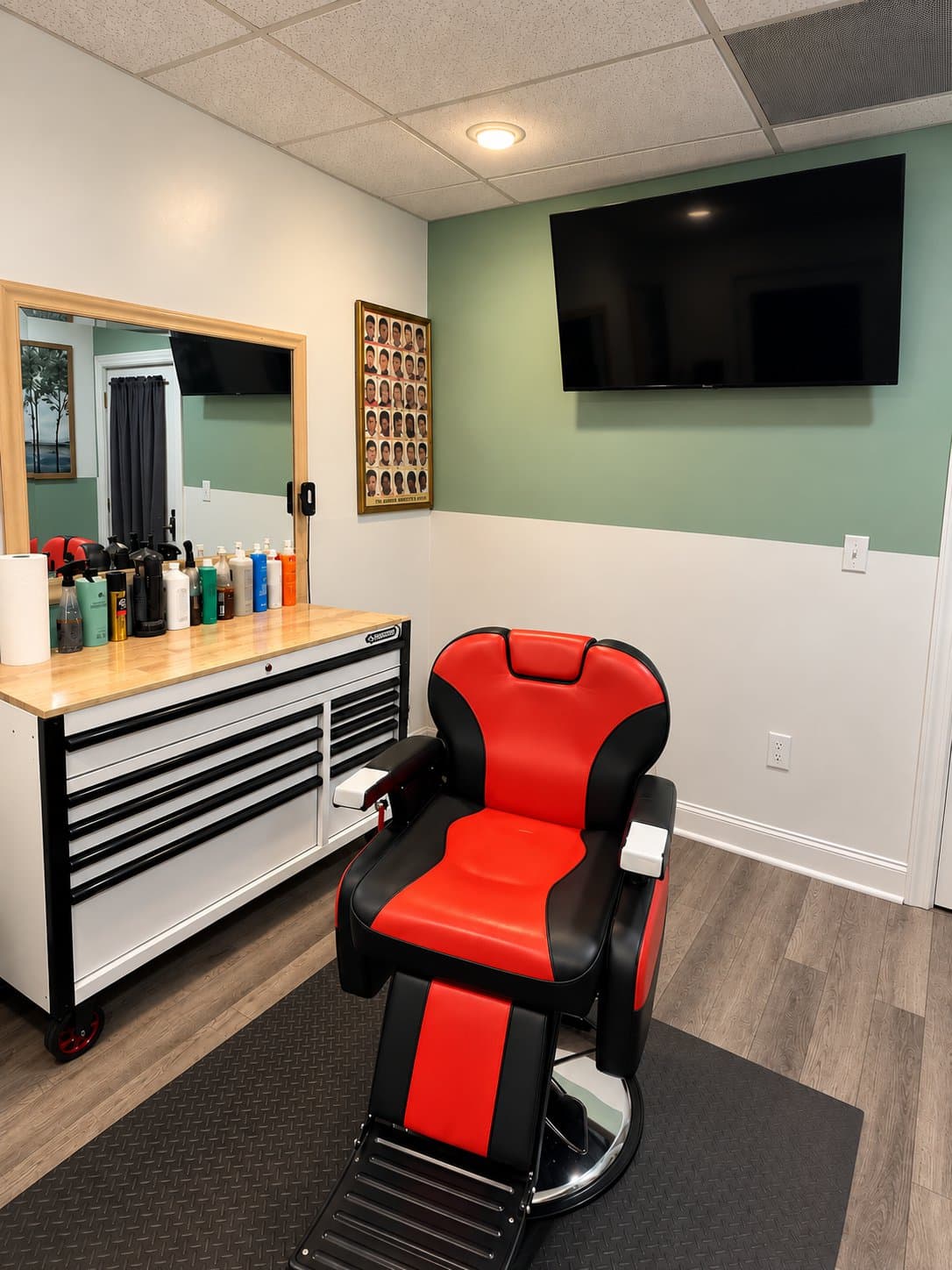 The red barber chair, station and mirror in Room 15
